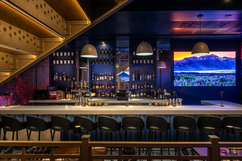 A moody space-themed bar inside Planet Hollywood New York City