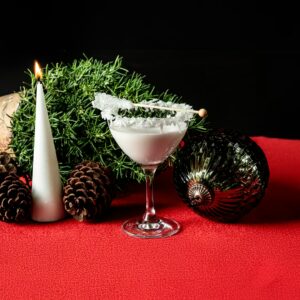 Coconut-rim white martini with winter garnish at Planet Hollywood NYC