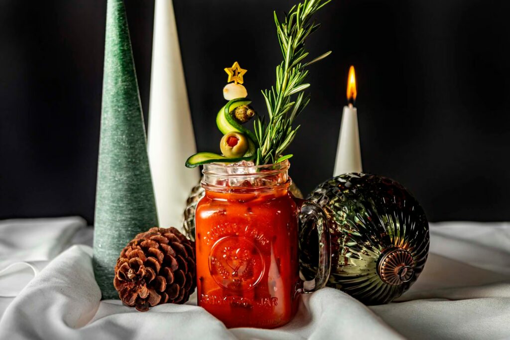 The "Bloody Merry" signature holiday cocktail at Planet Hollywood NYC, garnished with rosemary.