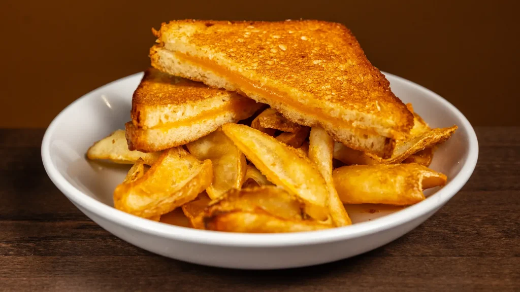 Kids grilled cheese with fries on a plate